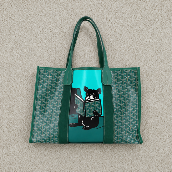 Green tote bag with black and white dog design on a beige background