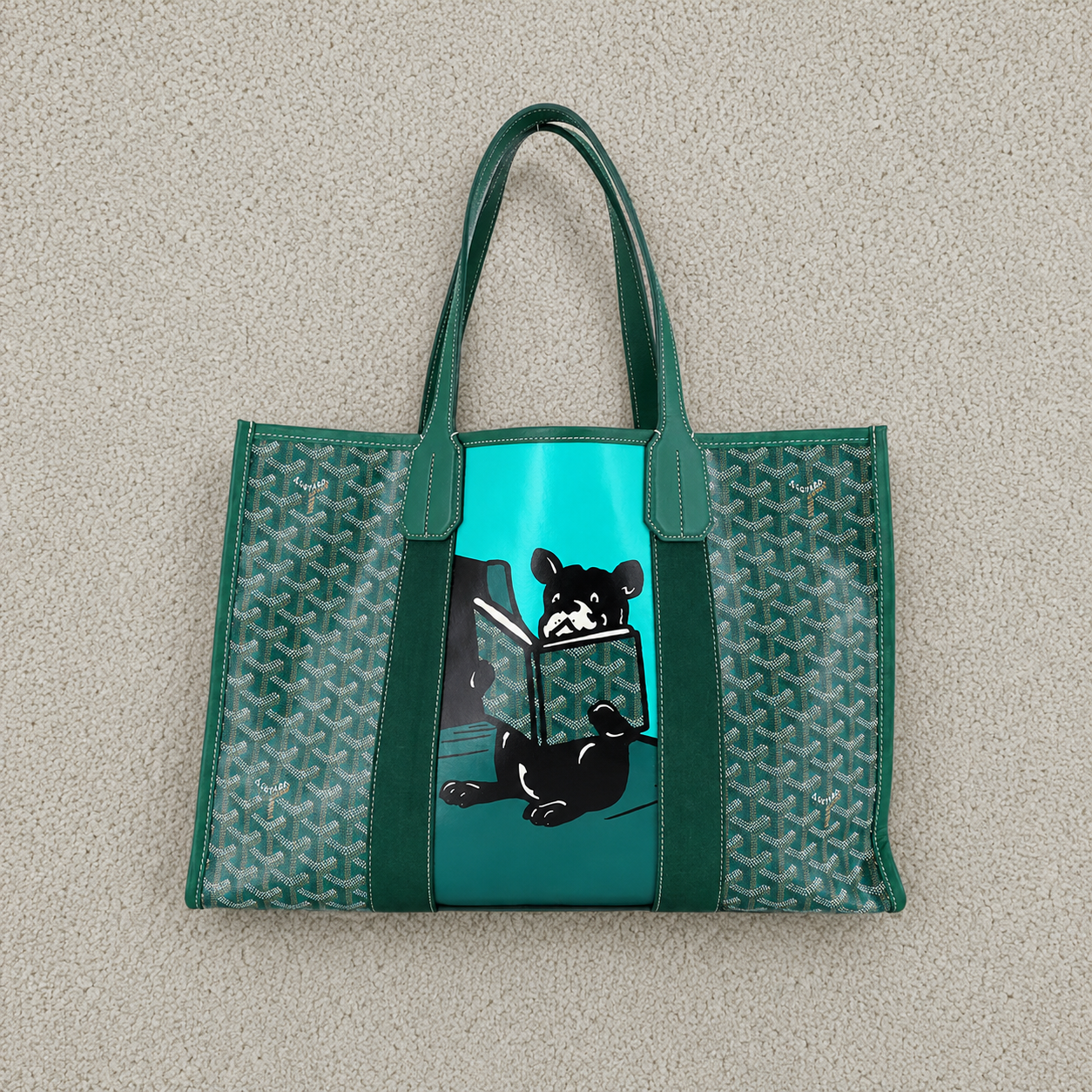 Green tote bag with black and white dog design on a beige background