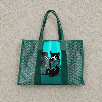 Green tote bag with black and white dog design on a beige background
